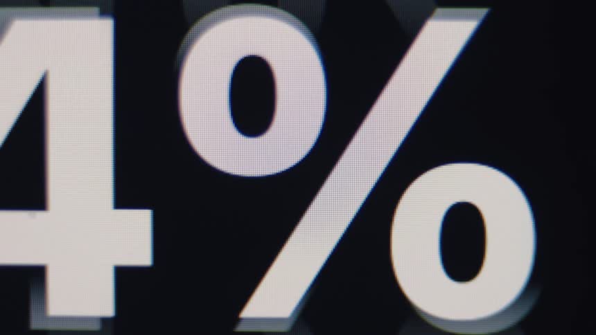 Close-up macro shot of a flickering percentage number counting up on a digital display