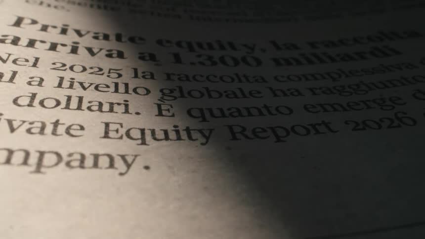 A beam of light moves across a close-up shot of a financial newspaper article about private equity