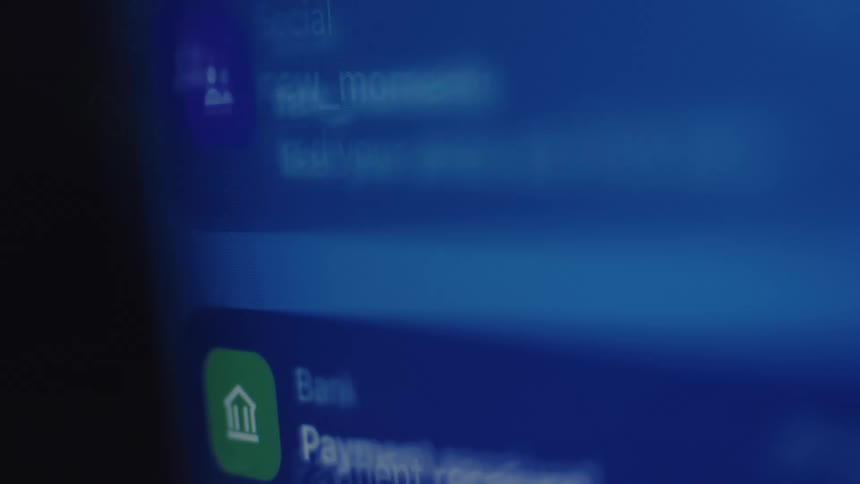 A close-up, blurry shot of a smartphone screen shows an endless stream of notifications from various apps
