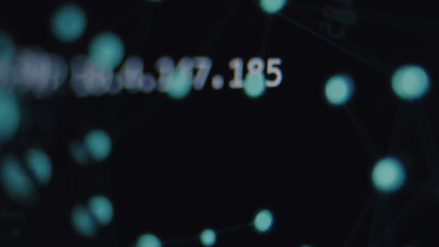 A close-up shot of a digital screen displays an animated network of data nodes, connections, and IP addresses, representing the flow of information