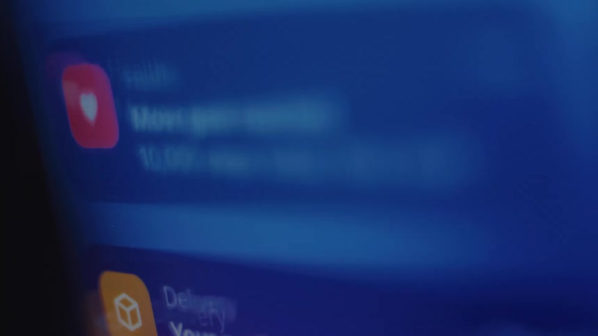 An endless stream of notifications from various apps scrolls up a smartphone screen in a seamless loop
