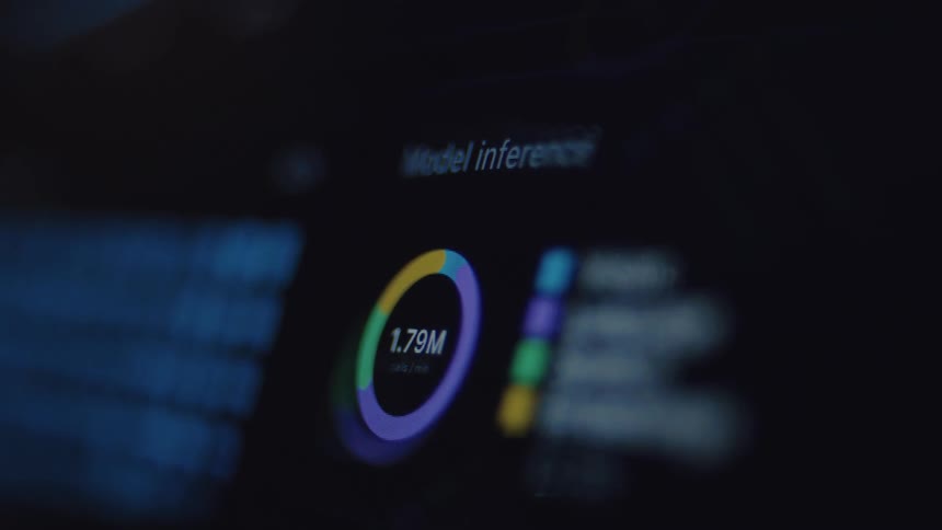 A close-up of a computer screen displays a real-time data visualization of a machine learning model inference process