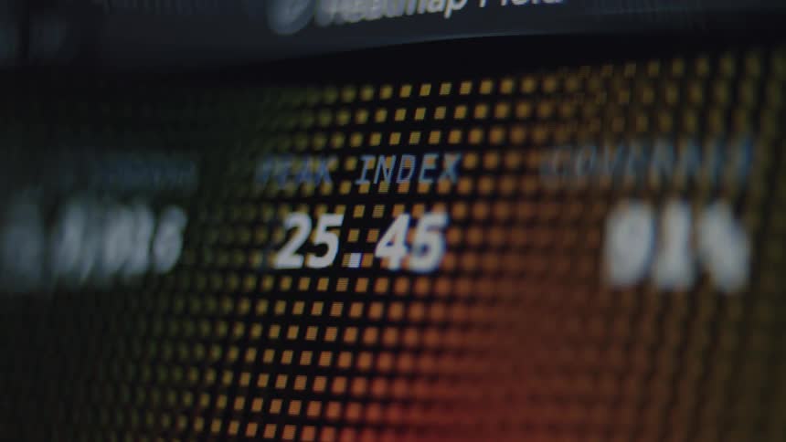 A macro shot of a financial peak index number fluctuating on a digital screen