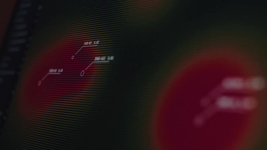 A close-up of a futuristic digital interface displaying animated data points and connections on a pixelated screen with a red glow
