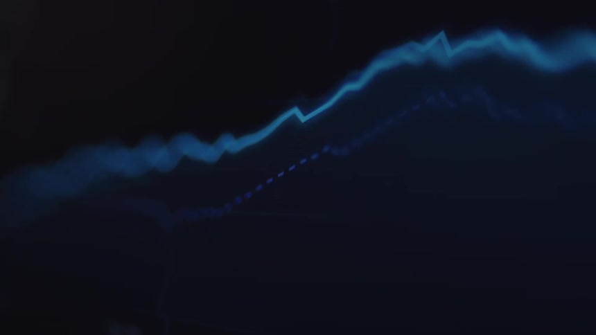A close-up, out-of-focus shot of a blue digital line graph fluctuating on a dark screen, representing stock market data or financial trends