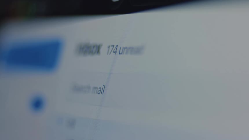 A time-lapse of an email inbox shows the unread message count rapidly increasing, symbolizing a heavy workload and digital overload