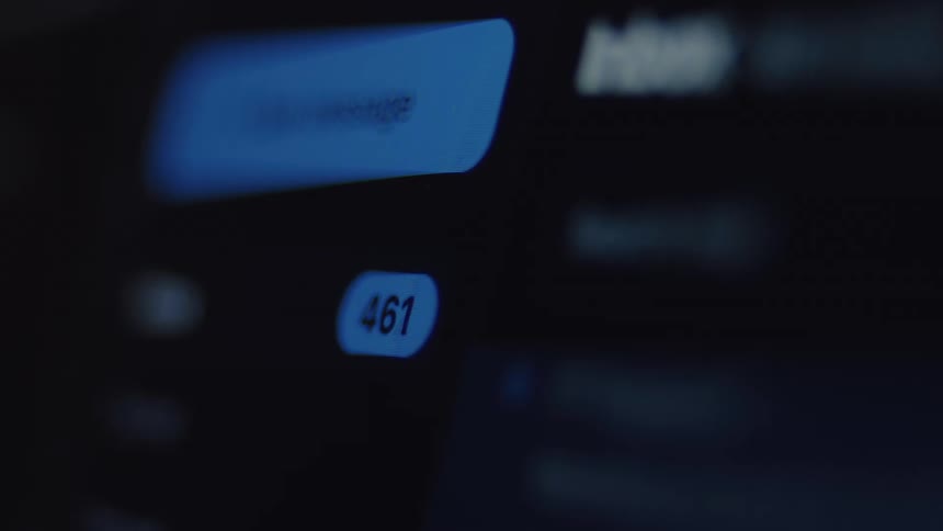 Macro shot of a social media notification counter for unread messages rapidly increasing on a digital screen