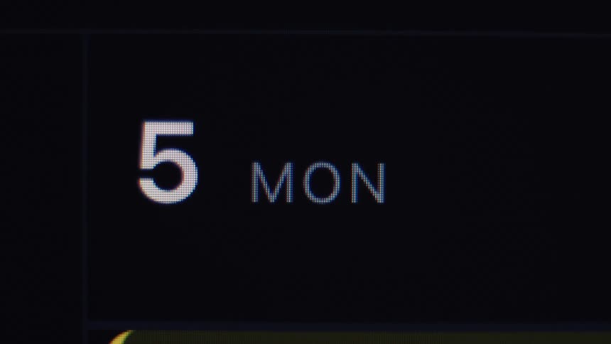 Macro close-up of a digital calendar on a screen showing Monday the 5th