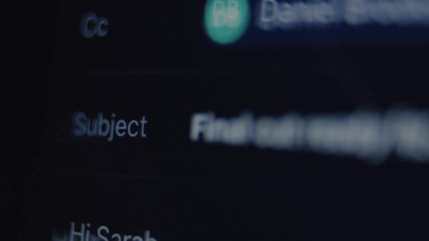 A close-up of a person typing 'Final edit' into the subject line of an email on a dark screen