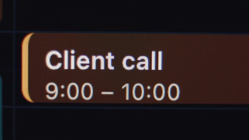 A macro close-up of a digital calendar screen shows an appointment for a client call from 9:00 to 10:00