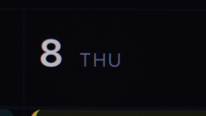 Extreme close-up macro shot of a digital calendar showing Thursday the 8th on a screen