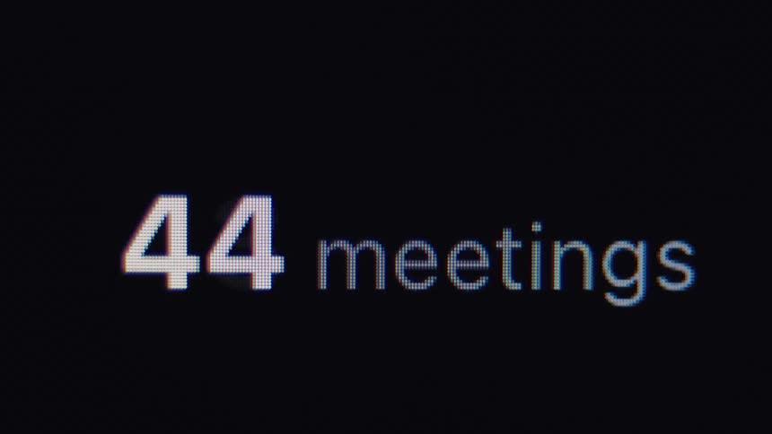 Close up on a digital counter showing the number of scheduled meetings rapidly increasing, symbolizing a busy workload