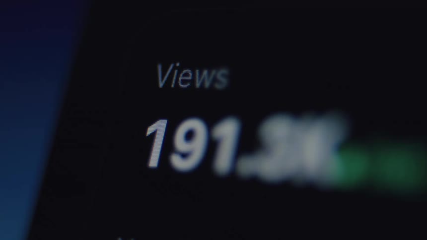 A close-up of a social media view counter rapidly increasing as a piece of content goes viral, reaching millions of views