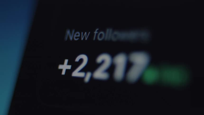 A close-up of a social media follower counter on a digital screen rapidly increasing, symbolizing viral growth and online popularity