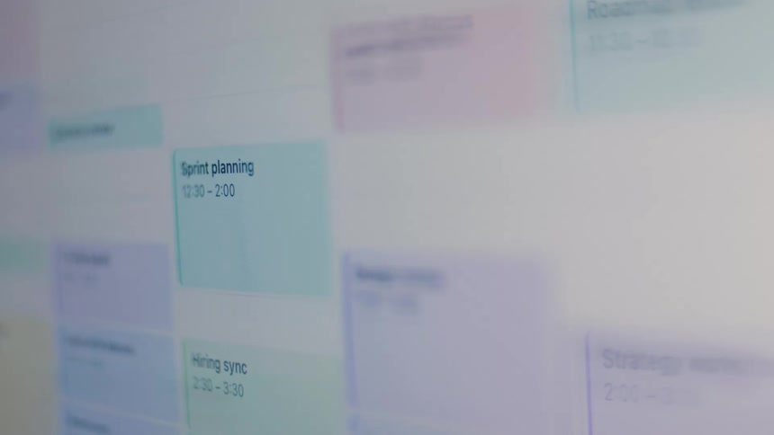 A close-up, out-of-focus view of a digital work schedule being scrolled on a computer screen