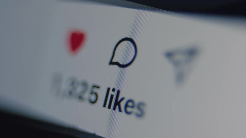 Macro view of a social media likes counter rapidly increasing, symbolizing viral popularity and online engagement