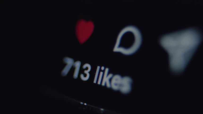 Macro shot of a social media like counter rapidly increasing as a post goes viral