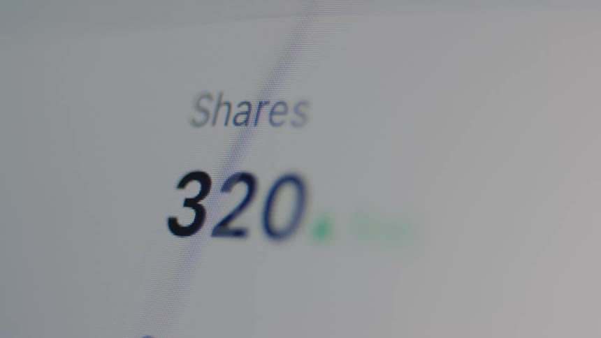 A close-up of a live digital counter rapidly tallying up shares on a computer screen