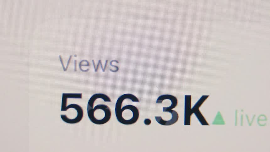 A close-up of a social media live view counter rapidly climbing into the millions, showing the video going viral
