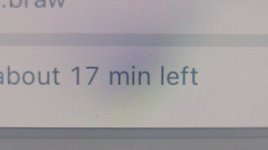 A frustrating close-up of a computer screen showing the estimated time remaining for a file transfer paradoxically increasing