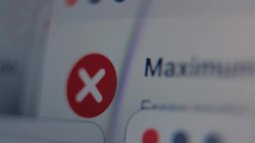 An extreme close-up reveals network connection error messages popping up on a computer monitor