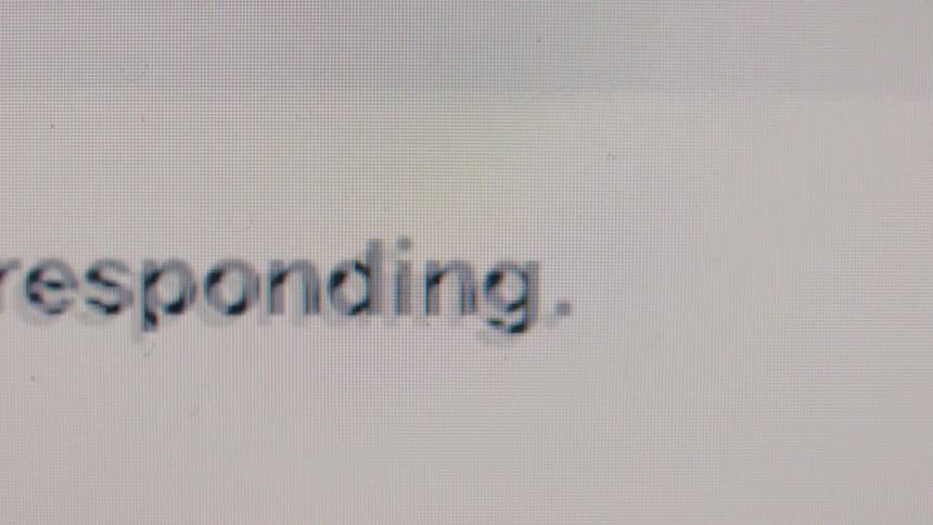 A chaotic montage of computer error messages and system failure warnings flashing on a screen