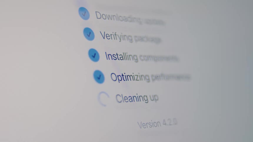 A close-up of a system update process on a digital screen, showing each step from downloading to the final 'update installed' checkmark