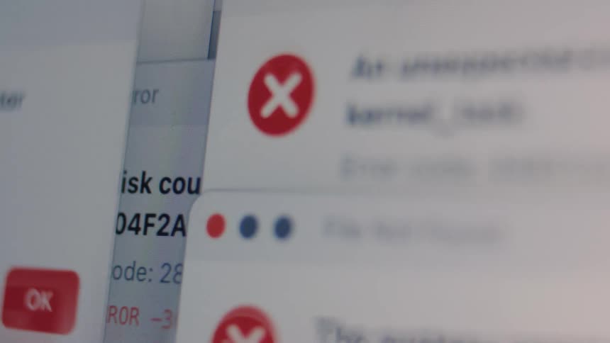 A fast-paced, abstract montage of various system error messages popping up on a computer screen, signifying a major crash