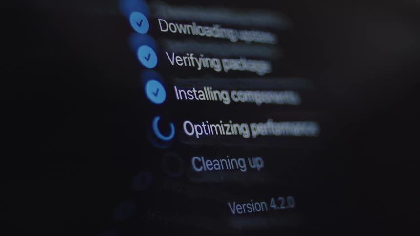 A close-up of a digital screen shows the step-by-step process of a software update being downloaded and installed