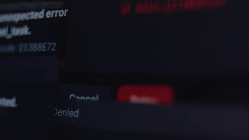 A close-up montage shows a computer system in meltdown with rapidly appearing virus alerts and critical error messages