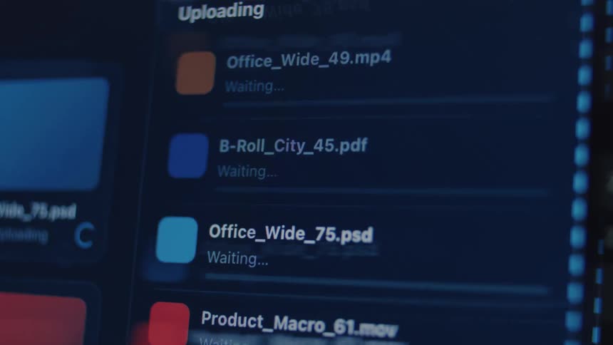 Close-up of a dark mode user interface displaying the upload progress of multiple digital files