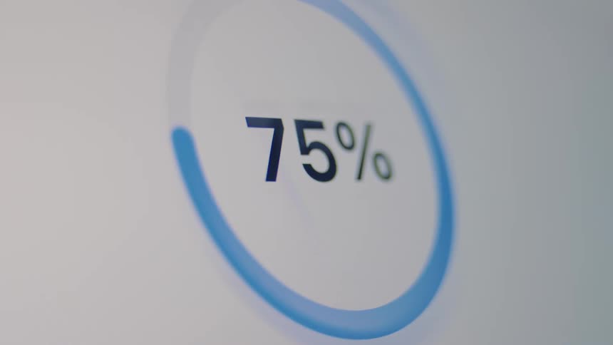 A circular progress bar on a digital screen loads from zero to one hundred percent, finishing with a checkmark to indicate the analysis is ready