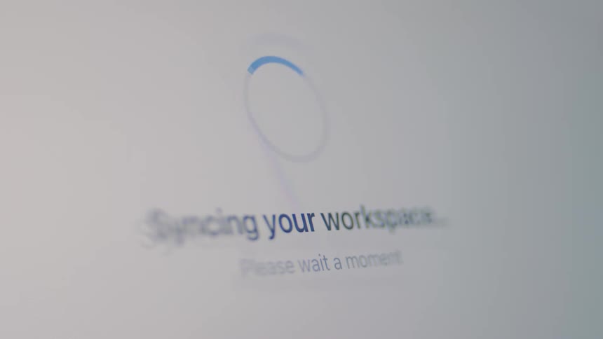 A close-up of a digital screen displays a loading animation as it connects to a server, authenticates, and syncs, finishing with a confirmation checkmark