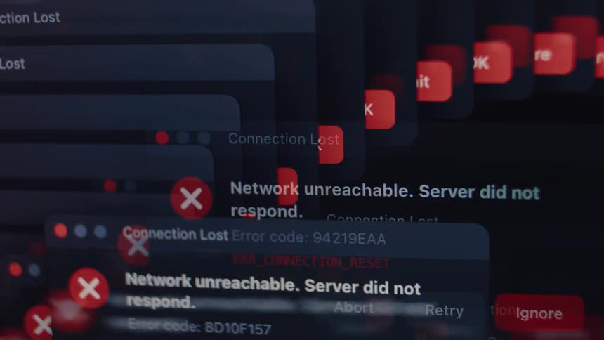 A chaotic cascade of system error messages on a computer screen indicates a critical failure or virus attack