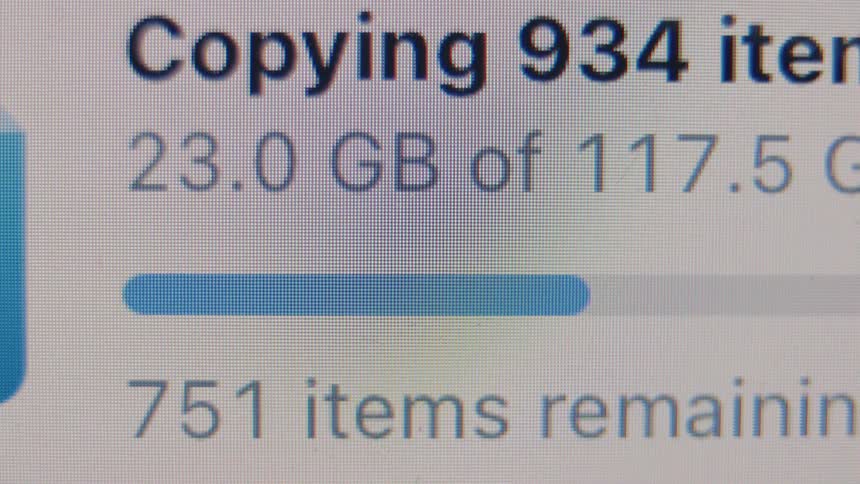 A real-time close-up of a computer screen showing the progress bar while copying a large amount of digital files
