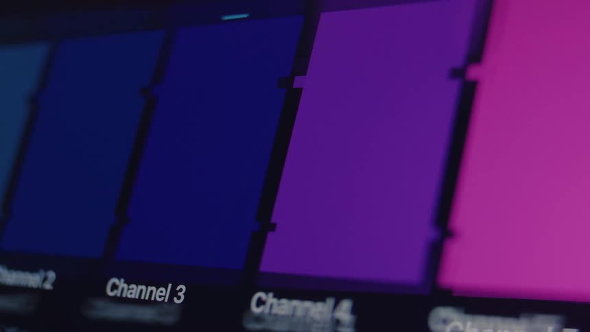 Digital television signal failure showing corrupted color bars and pixelated glitches on a screen