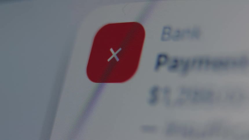 A macro shot shows a failed payment notification with a shaking red error icon on a digital screen