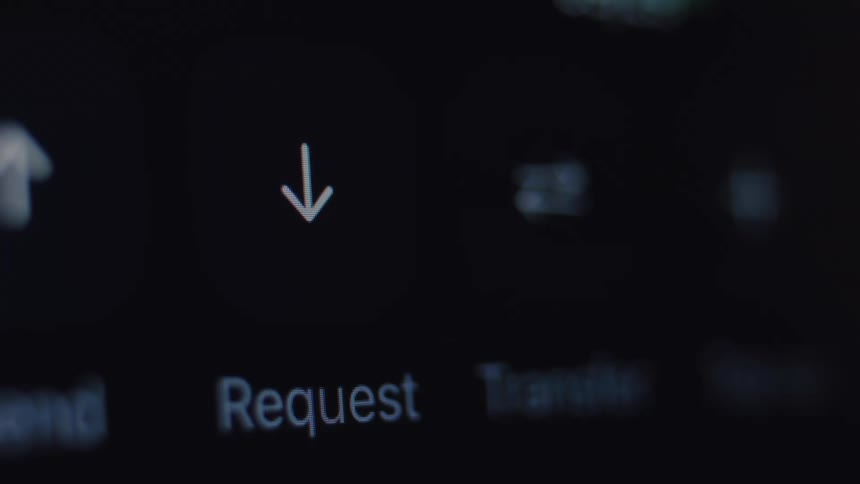 Extreme close-up of a finger tapping the 'Request' button on a mobile banking application screen