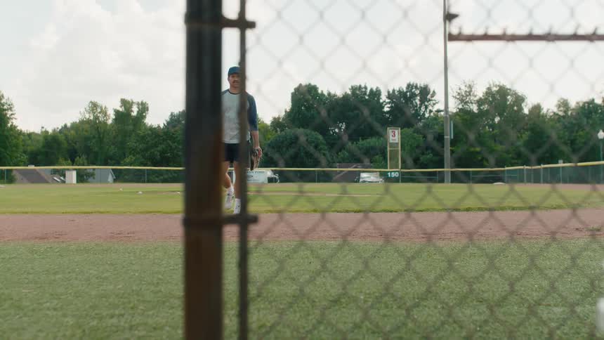 A young baseball player celebrates running the bases as his proud father watches, and they later find a sentimental handwritten note in the dugout