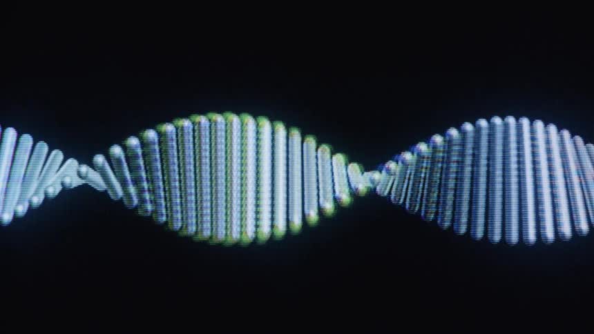 A digital animation of a slowly rotating DNA double helix molecule on a black background
