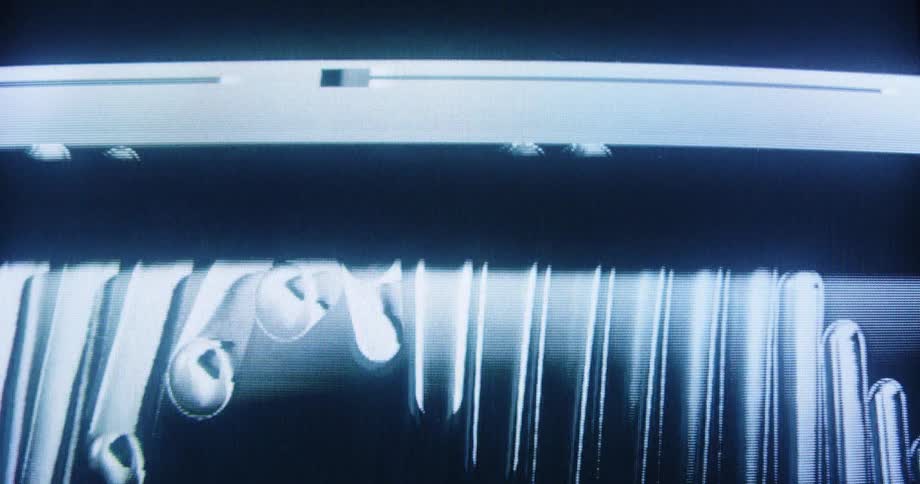 Severe analog video distortion with abstract glitches and warped, melting lines on a dark screen