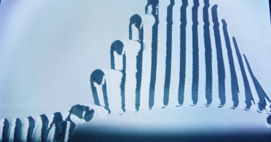 An abstract animation of distorted vertical lines forms a wavy pattern with a retro VHS glitch effect