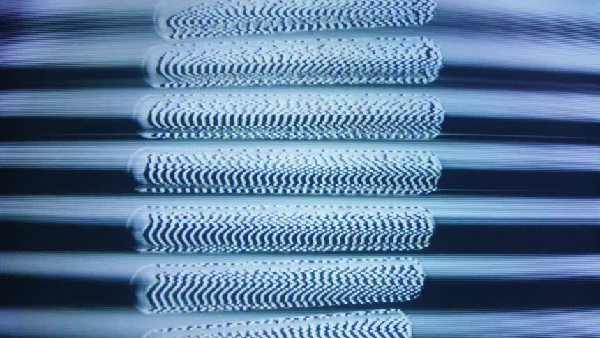 Abstract animation of distorted, pill-shaped static patterns rippling in a vertical column on a screen