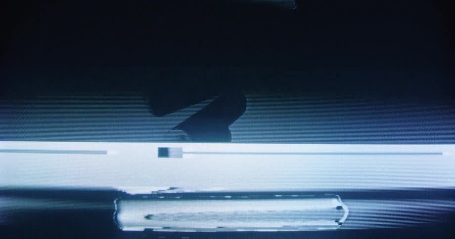Close-up of abstract rounded bars animating with heavy analog television glitch and distortion effects