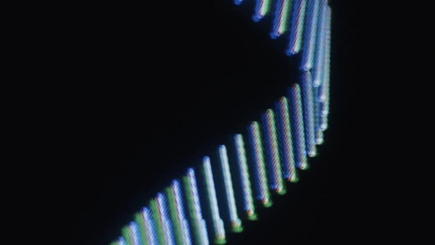 A macro shot shows an abstract spiral of glowing lines with an RGB glitch effect rotating on a digital screen