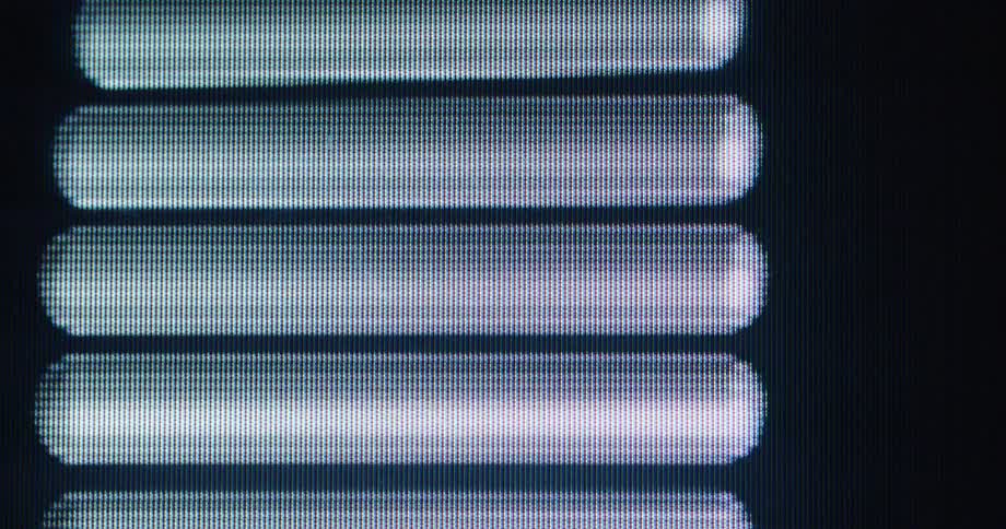 Macro shot of an abstract, pulsing equalizer-style animation on a pixelated digital screen