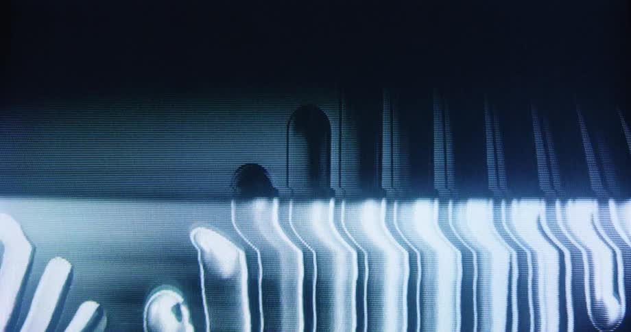 Analog video synthesizer creates abstract, wavy patterns on a CRT display