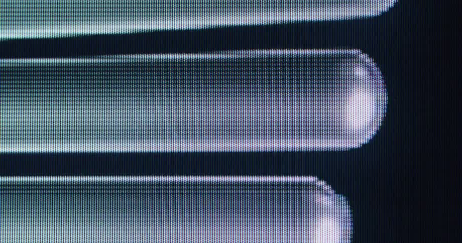 An extreme close-up, pixelated view of abstract message bubbles scrolling on a digital screen