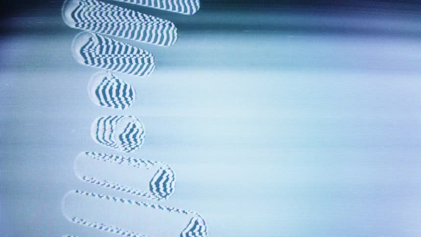 A close-up of a television screen displays looping, distorted static bars with a retro glitch effect