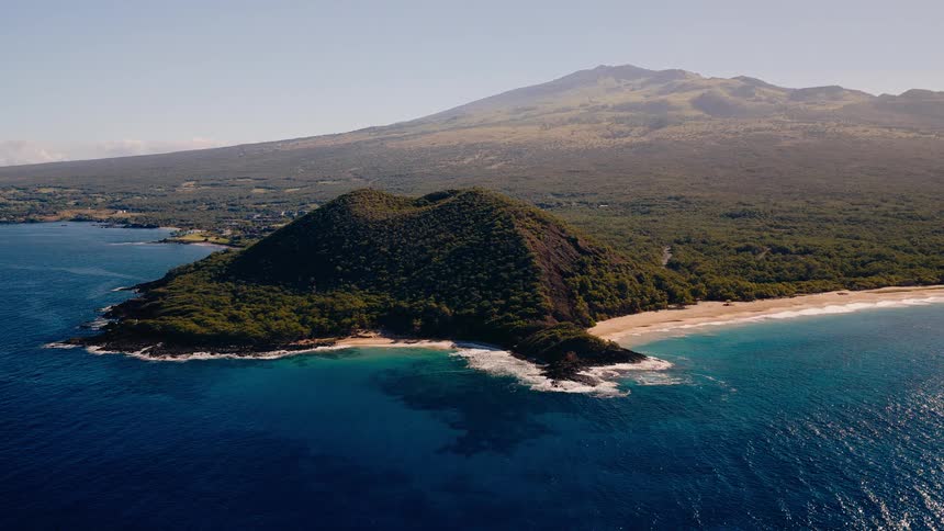 Stunning aerial view of the iconic heart-shaped volcanic cinder cone on a lush tropical island coastline surrounded by the Pacific Ocean